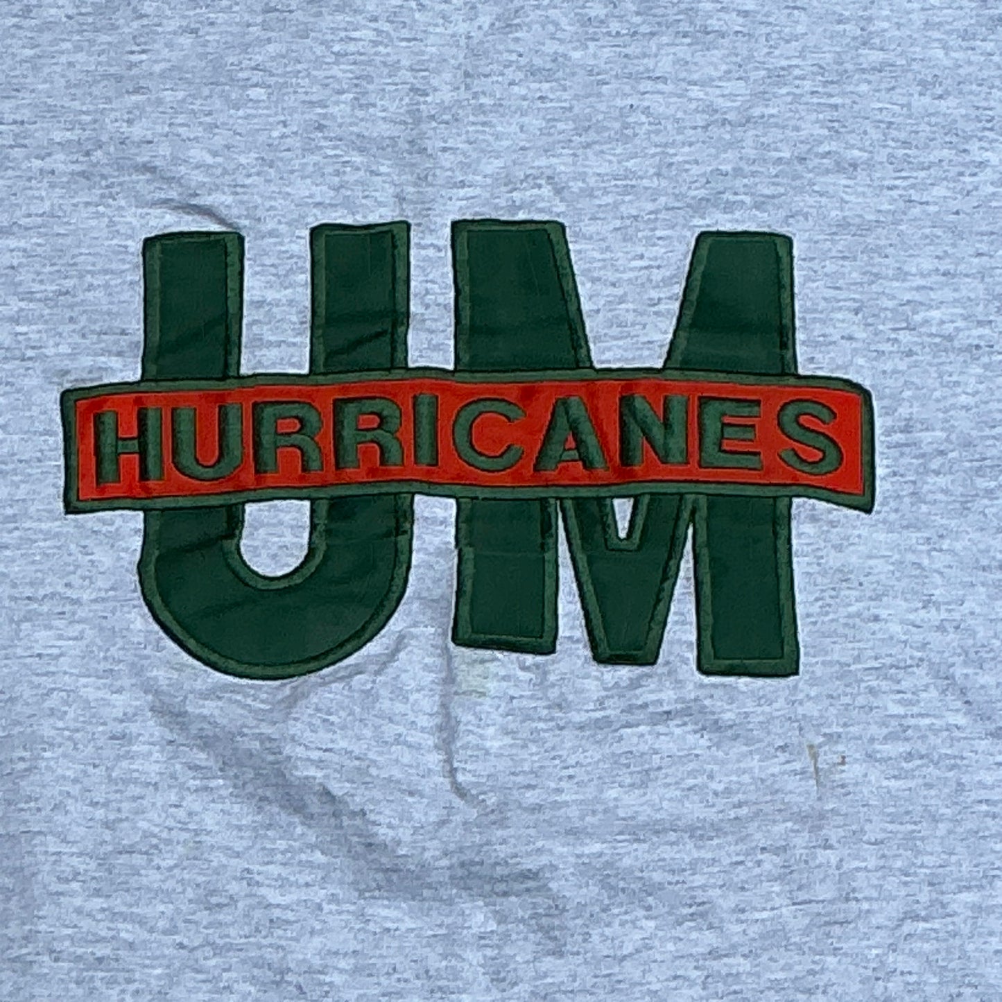 Raised UM Tee - L